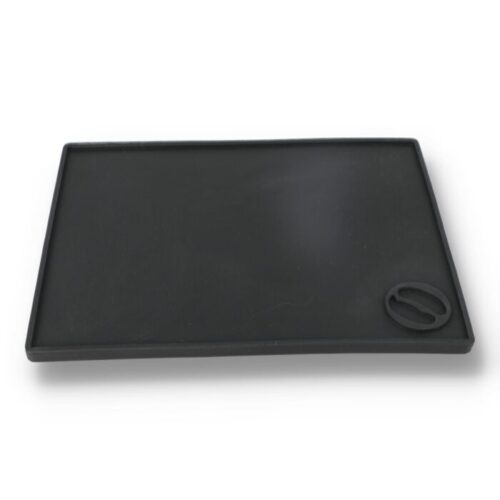 Large, bordered tamping mat.